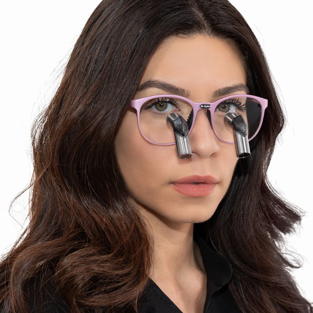 Female dental professional wearing Q-Optics Ero-Pro loupes