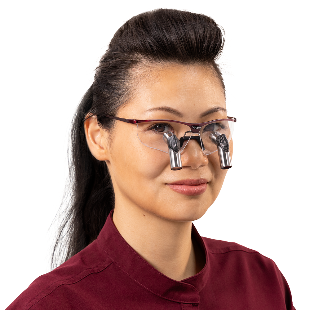 Female dental professional wearing Q-Optics Ero-Pro loupes